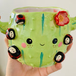 Flowery cactus pot with lady bug friends