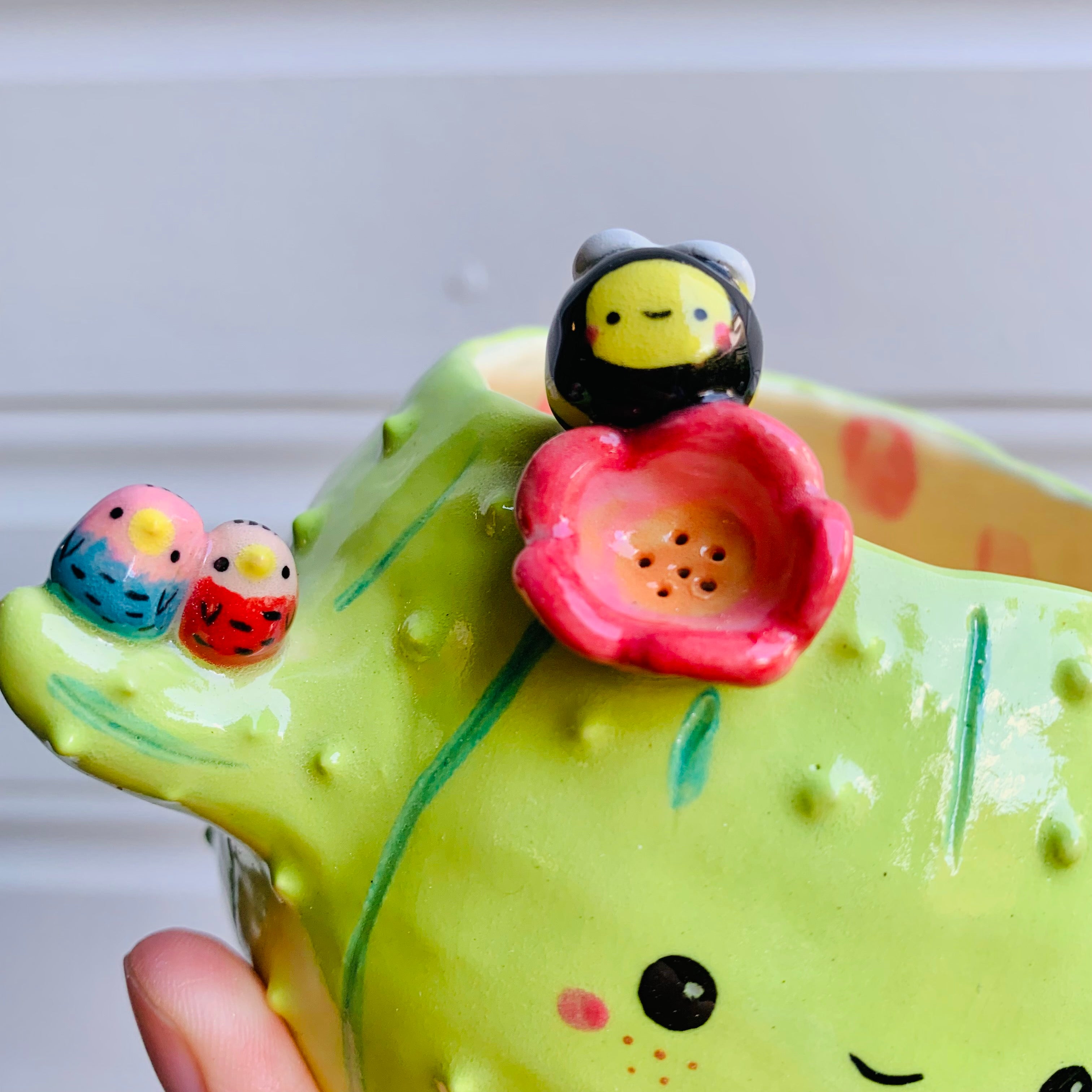 Flowery cactus pot with bird and bee friends