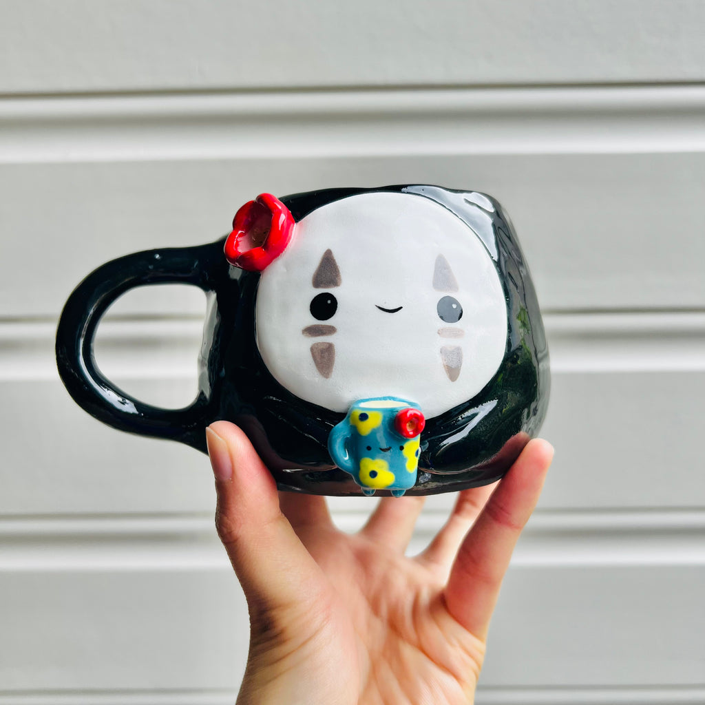 No face mug with blue mug friend