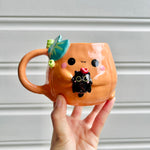 Halloween pumpkin mug with black cat friend