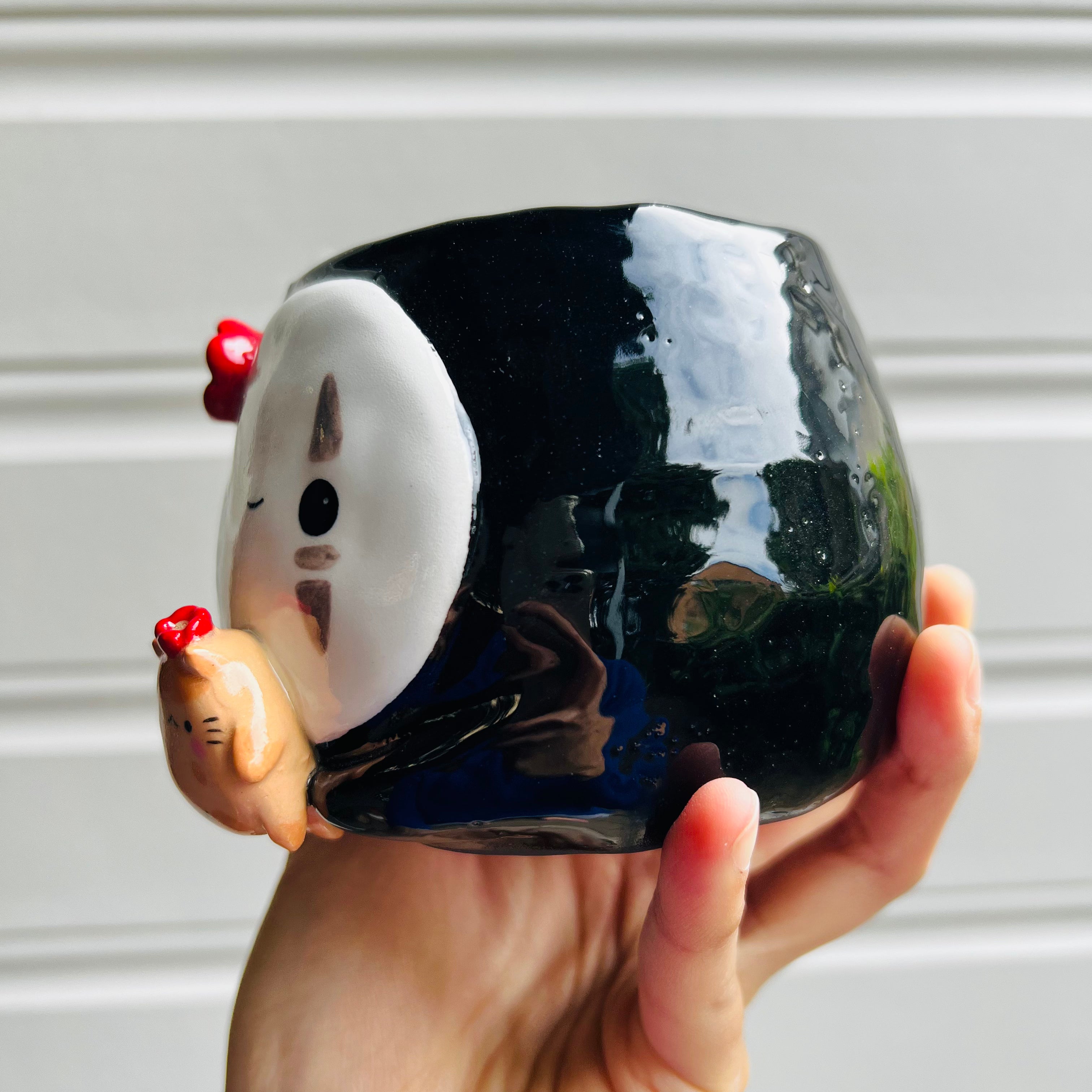 No Face pot with ginger cat friend