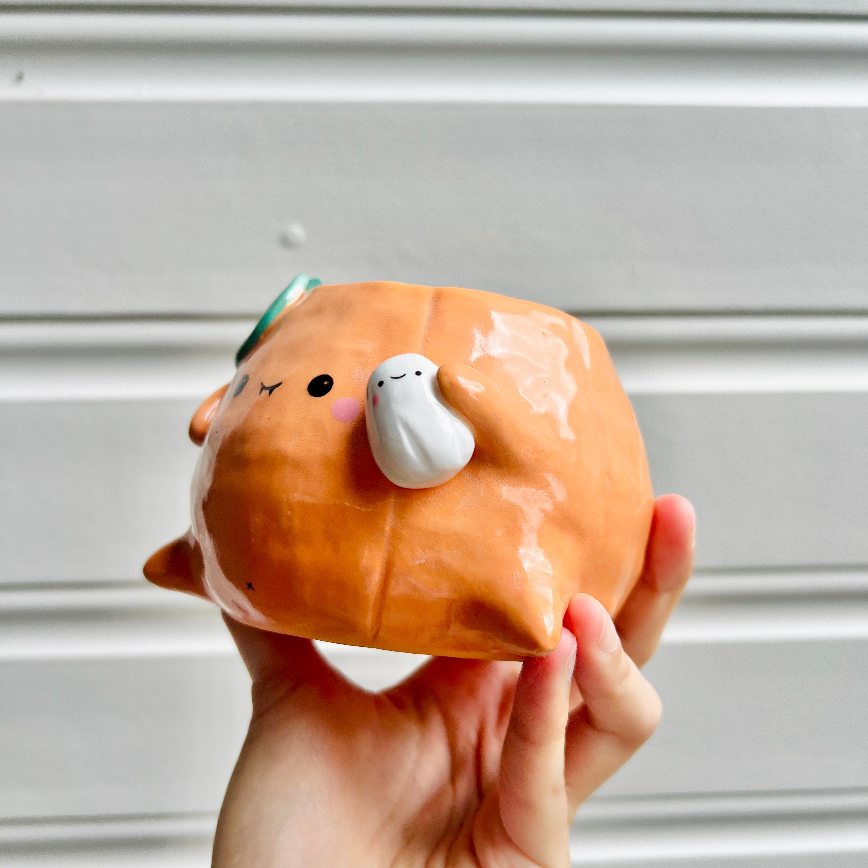 Halloween pumpkin pot with ghost friend