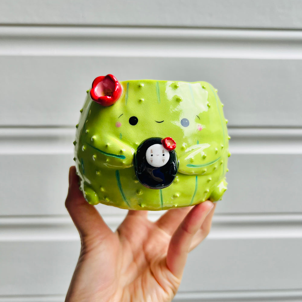 Flowery cactus pot with No face friend, photo 1 of 6