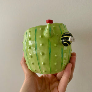 Flowery cactus pot with busy bee friends