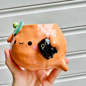 Halloween pumpkin pot with black cat friend