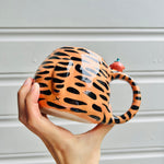 Hat wearing tiger with mandarin friend mug with mandarin