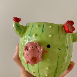 Flowery cactus pot with pig friend