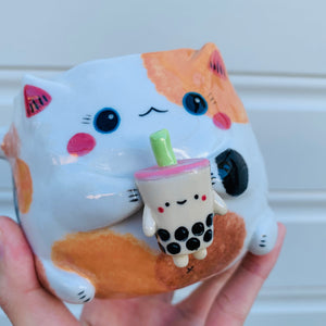 Spotty cat with bubble tea mug