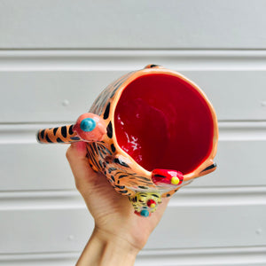 Hat wearing tiger with mandarin friend mug with baby tiger