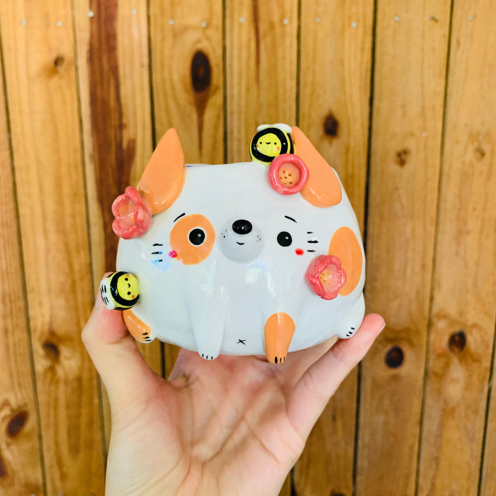Orange spotty doggo pot with bee friends, photo 1 of 9