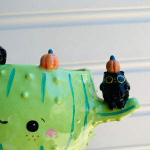 Pumpkin cactus pot with black cat friends