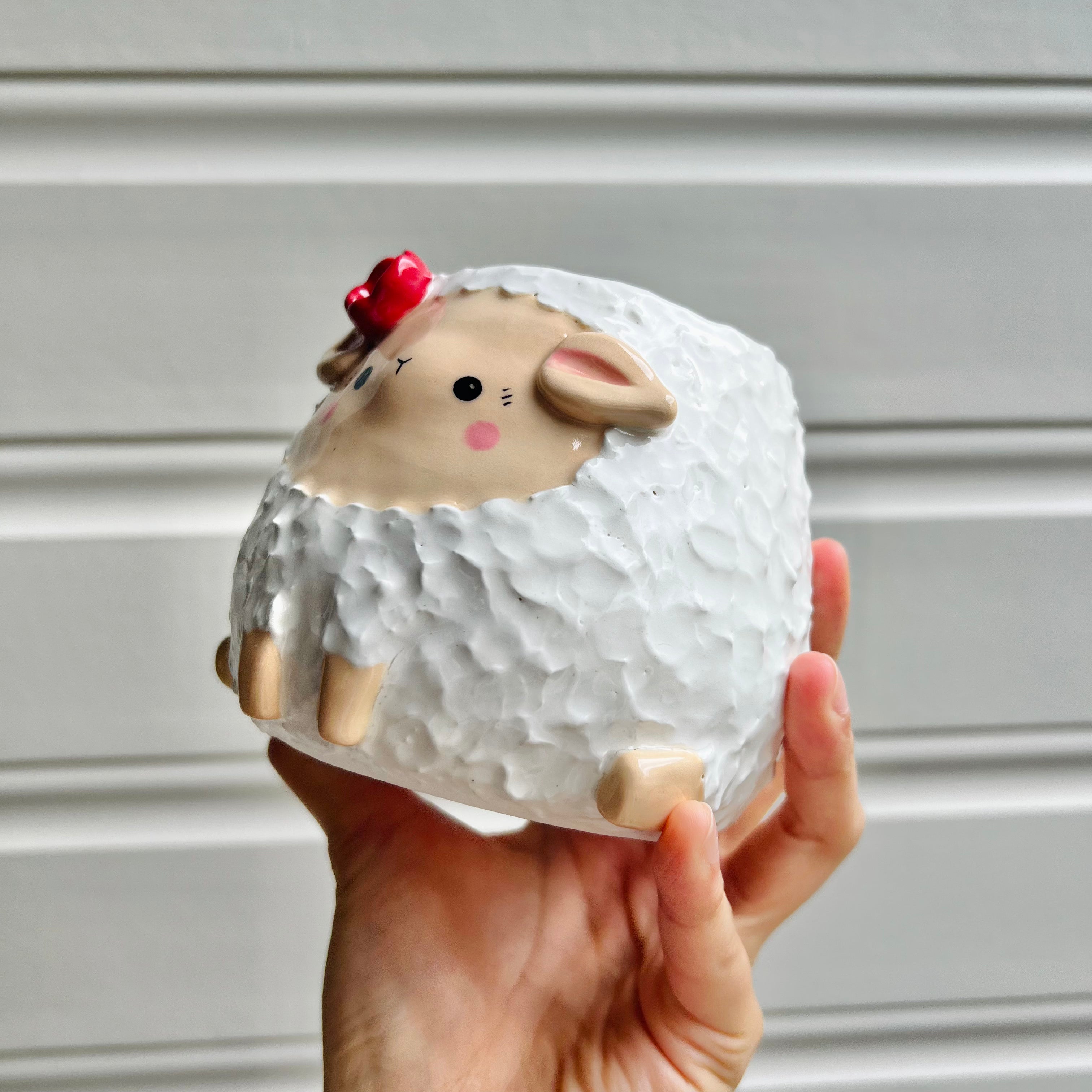 Flowery sheep pot