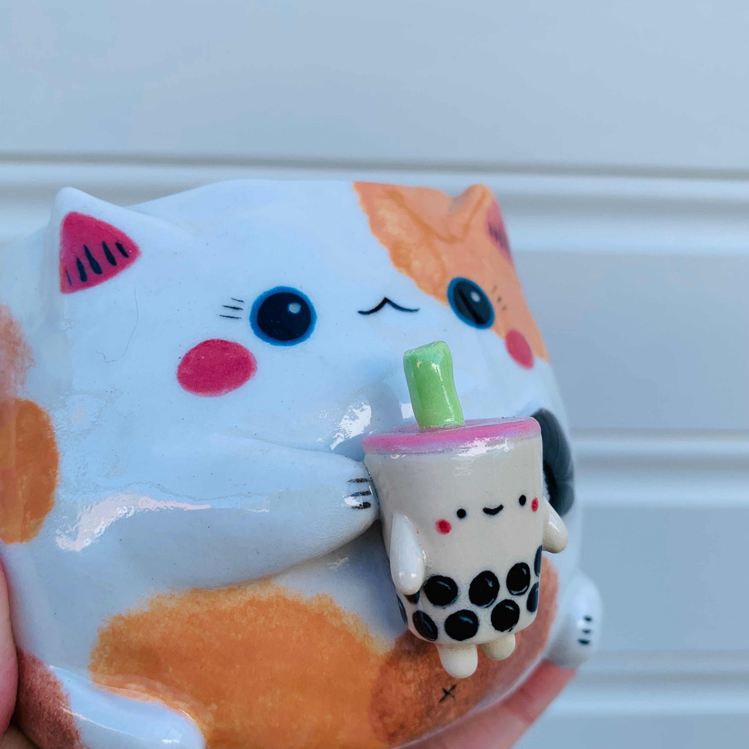 Spotty cat with bubble tea mug