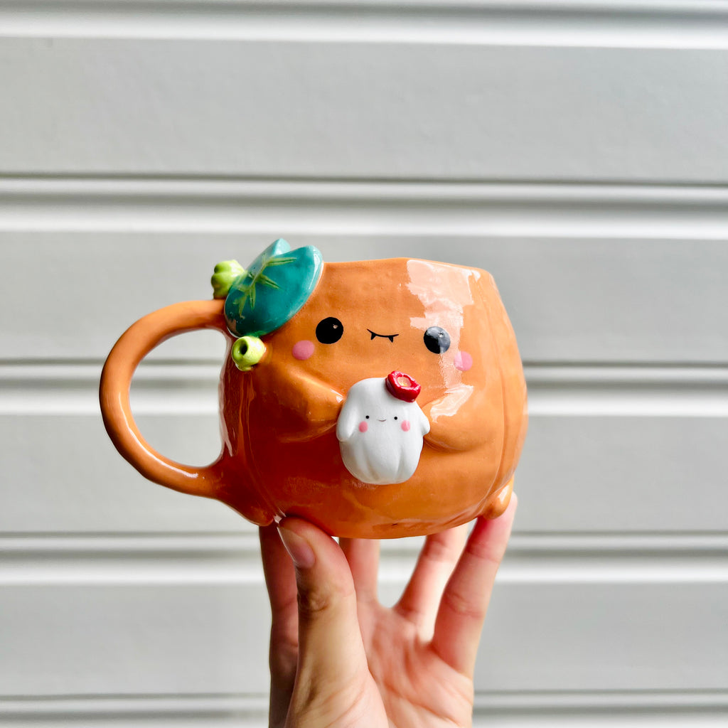 Halloween pumpkin mug with ghost friend