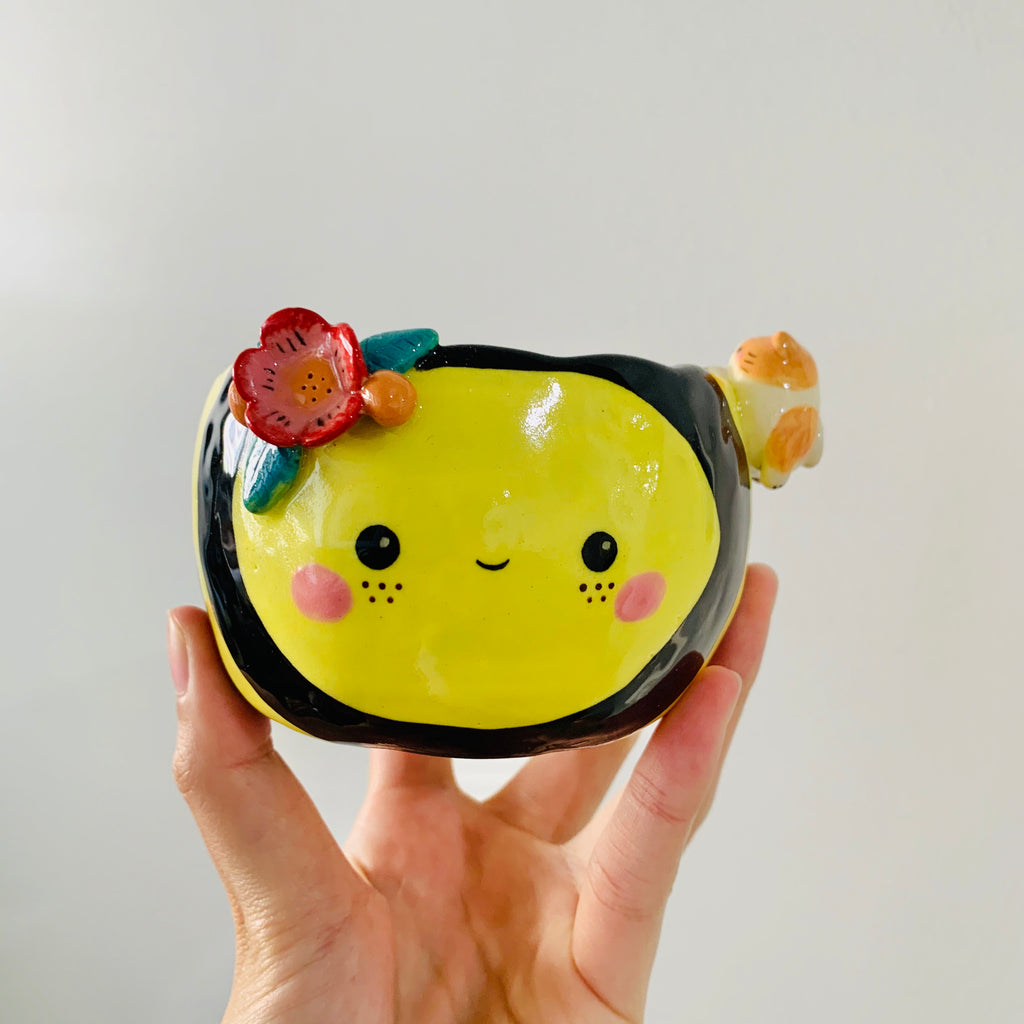 Flowery bee snack bowl with cat friend