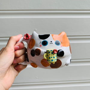 Spotty KITTY coffee pun mug with mug friend