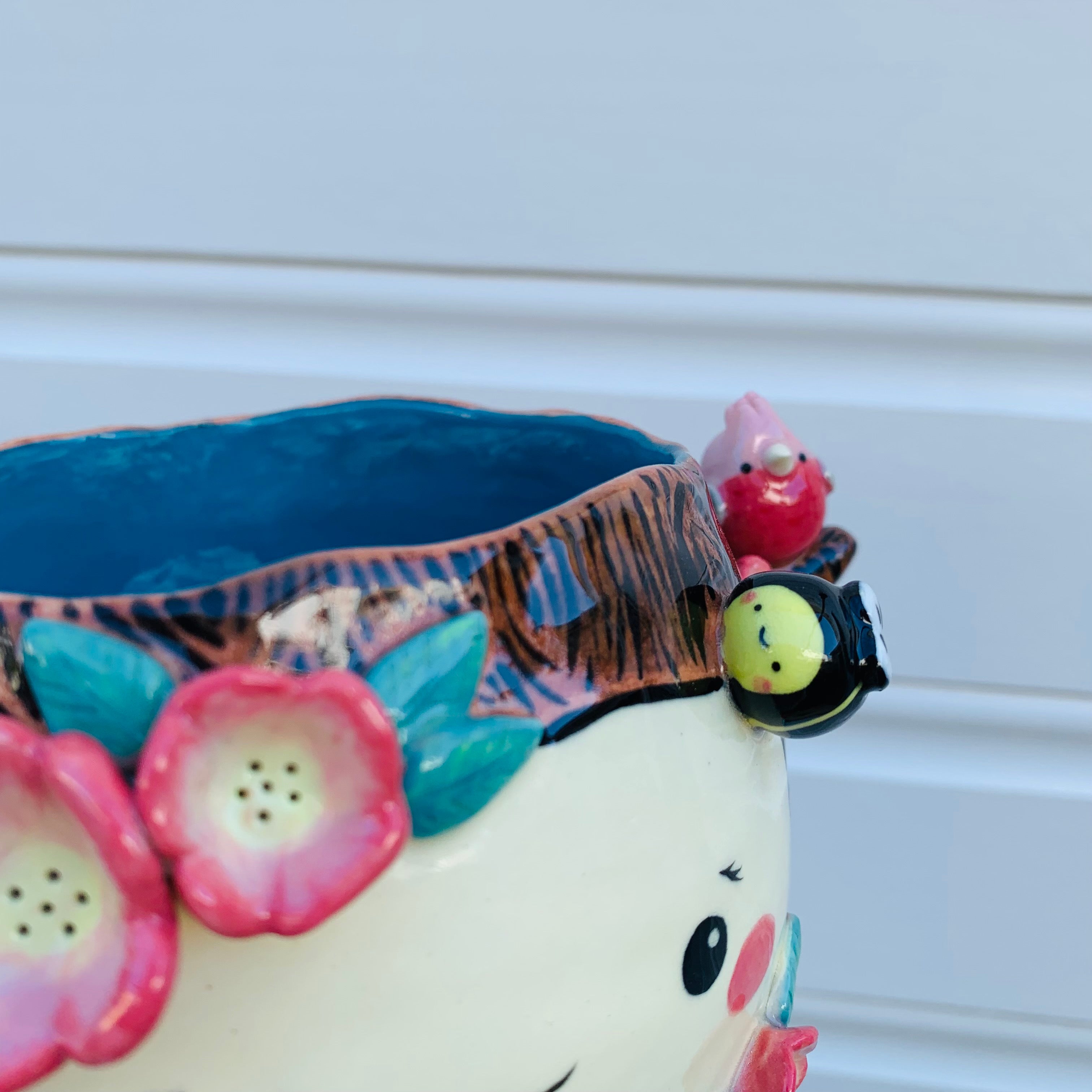 Happy flowery tree with bees, cat and pink galah planter