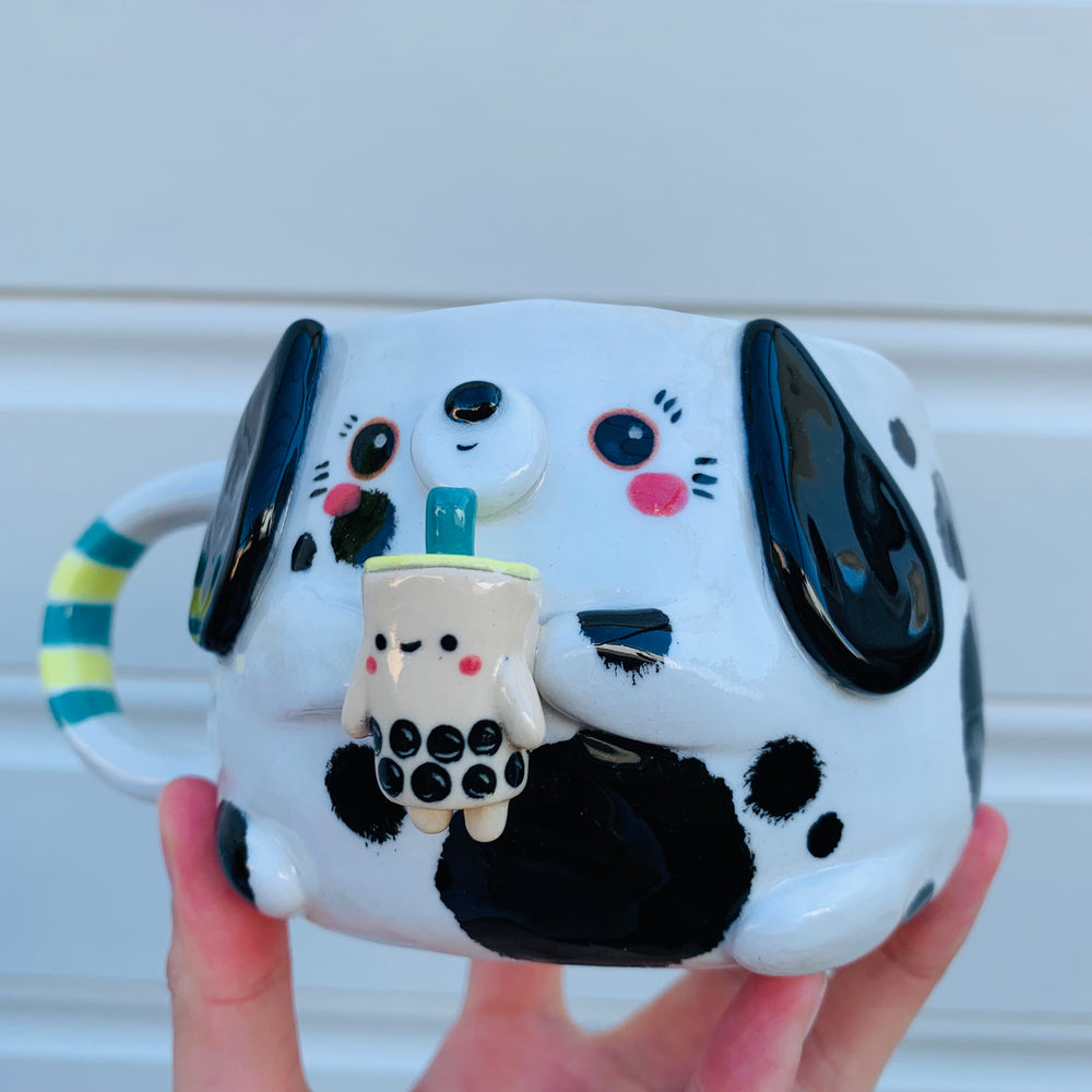 Black and white spotty doggo with bubble tea mug, photo 3 of 10