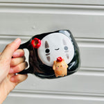 No Face mug with ginger cat friend