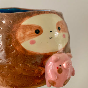 Friendly sloth pot with pig friend