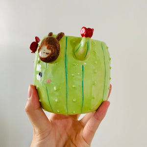 Flowery cactus pot with sloth friend