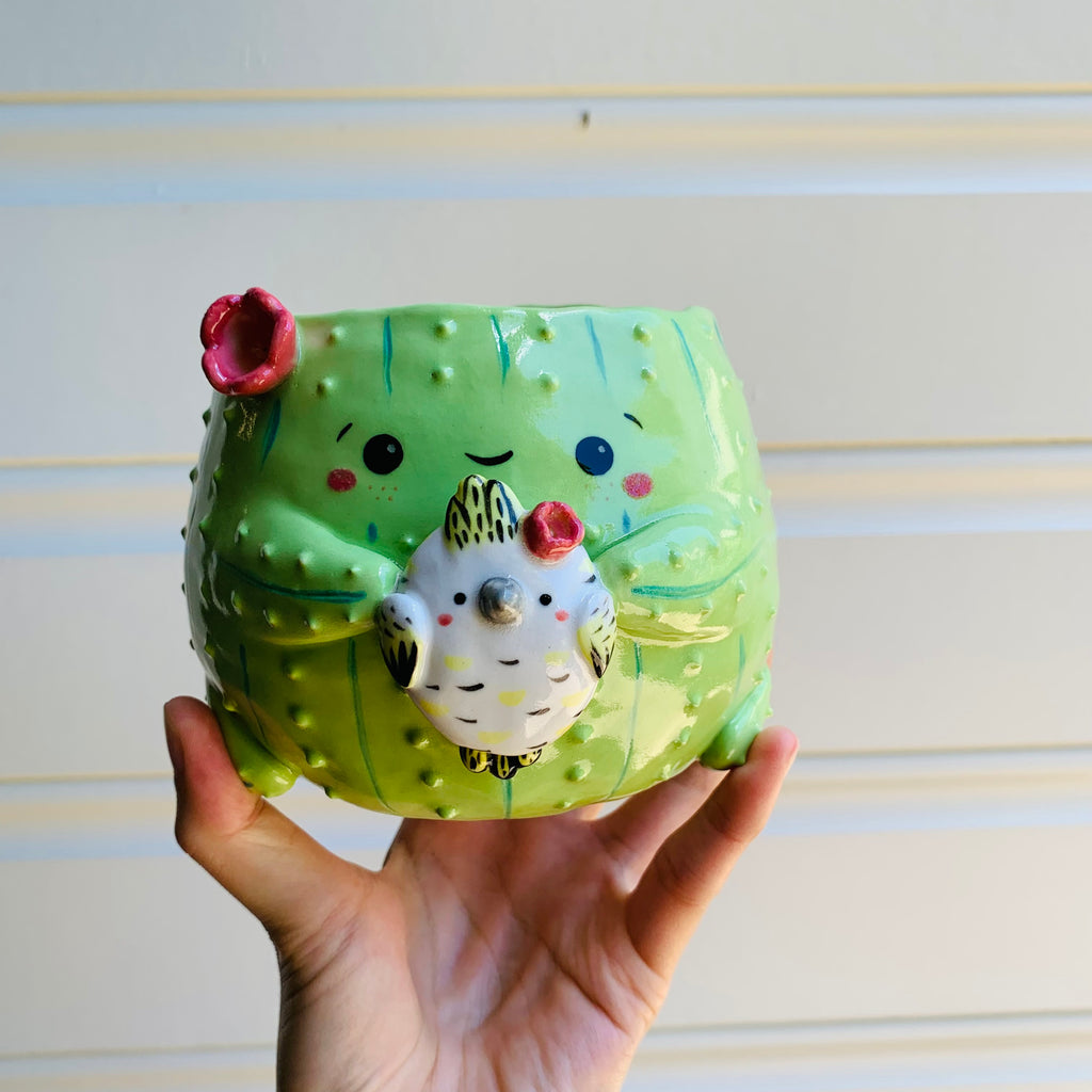 Flowery cactus pot with cockatoo friend