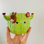 Flowery cactus pot with sloth friend