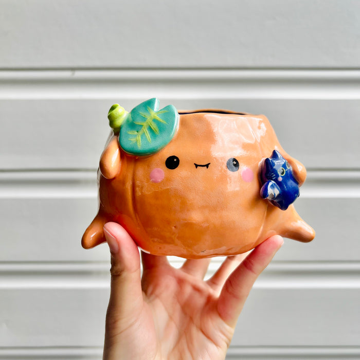 Halloween pumpkin pot with bat friend