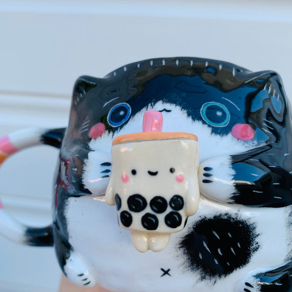 Black and white cat with bubble tea mug, photo 4 of 10