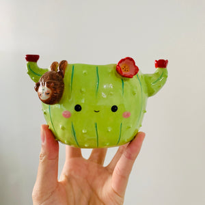 Flowery cactus pot with sloth friend