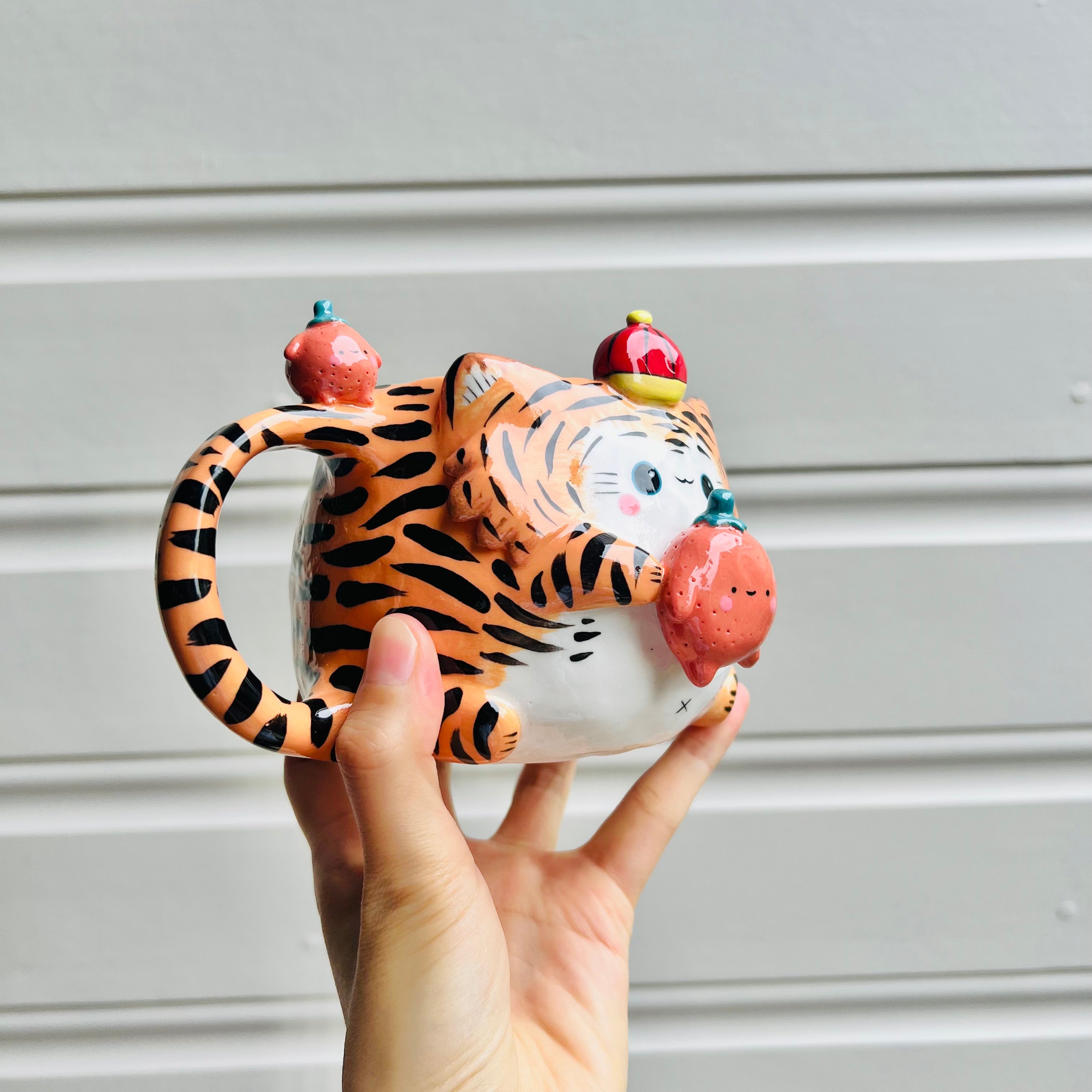 Hat wearing tiger with mandarin friend mug with mandarin