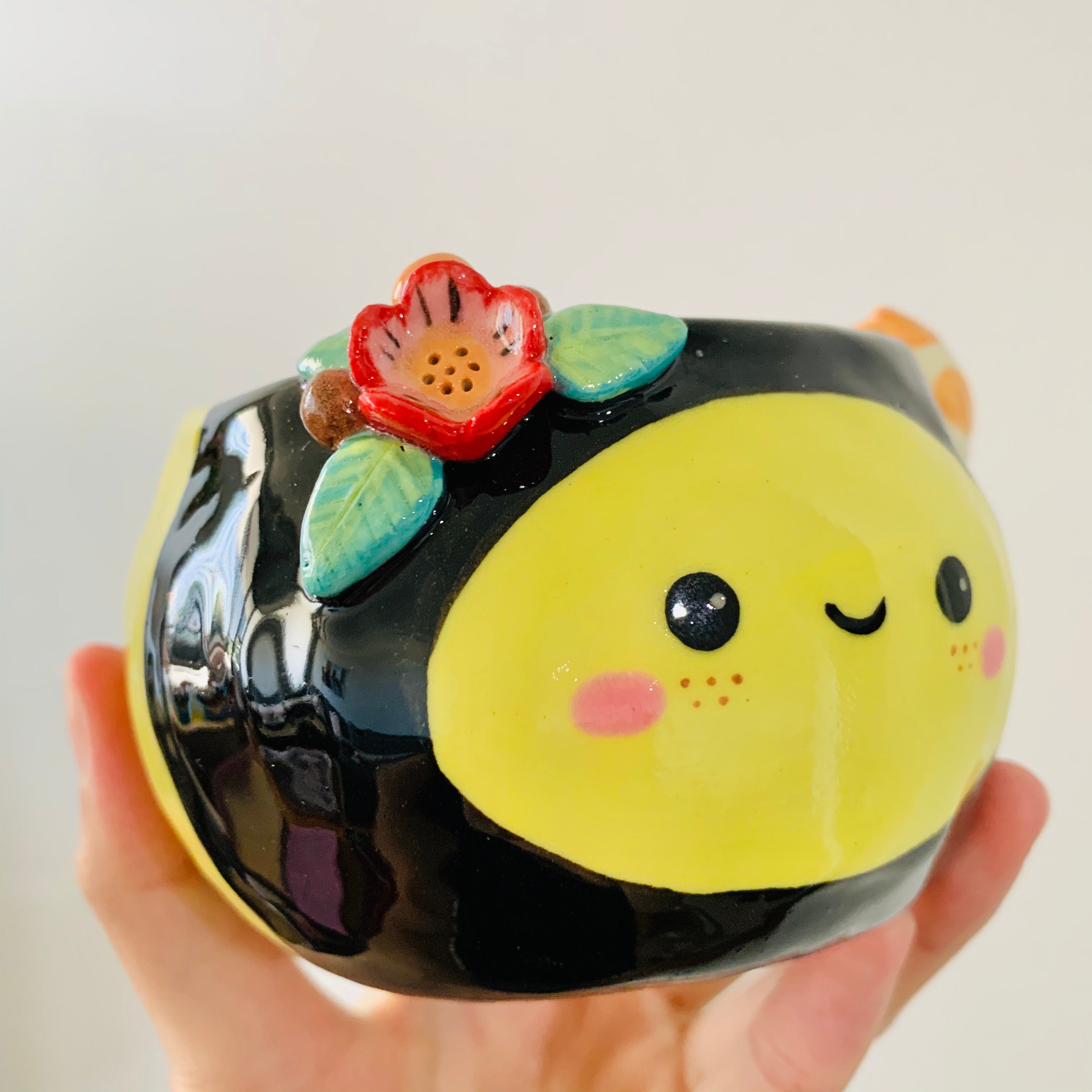 Flowery bee snack bowl with cat friend