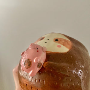 Friendly sloth pot with pig friend