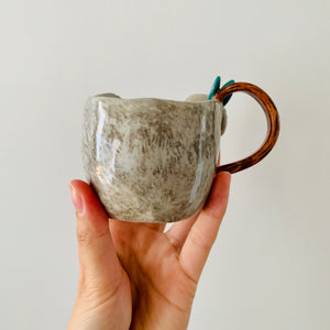 Koala with cockatoo friend mug
