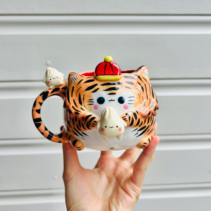 Hat wearing tiger mug with dumpling friends