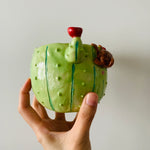 Flowery cactus pot with sloth friend