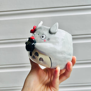 Totoro pot with black cat friend