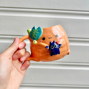 Halloween pumpkin mug with bat friend