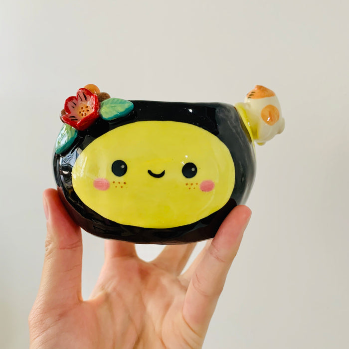Flowery bee snack bowl with cat friend