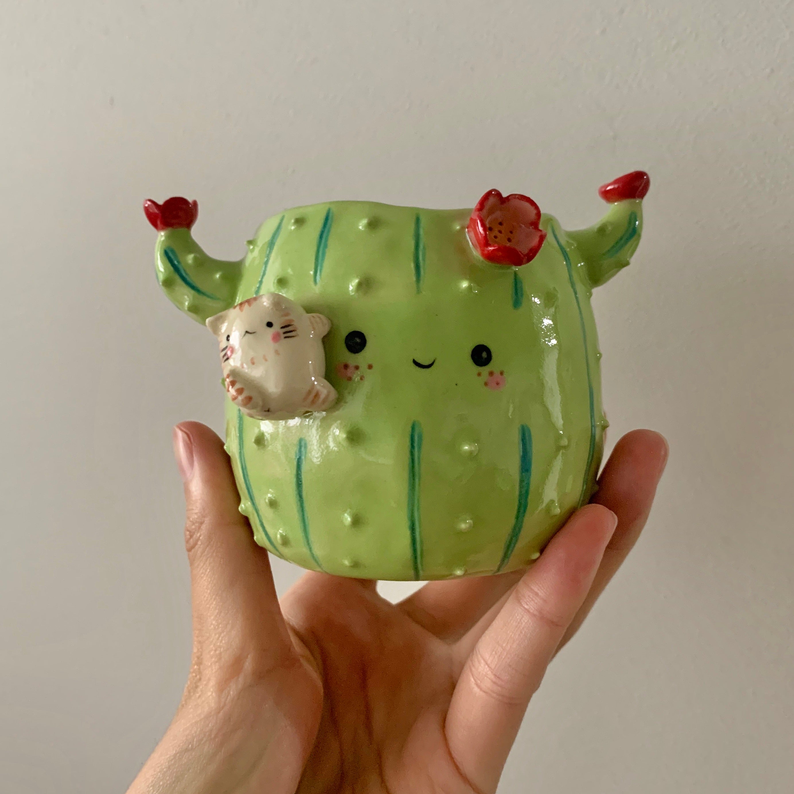 Flowery cactus pot with cat friend