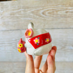 LNY cape wearing bunny vase with Daruma friend