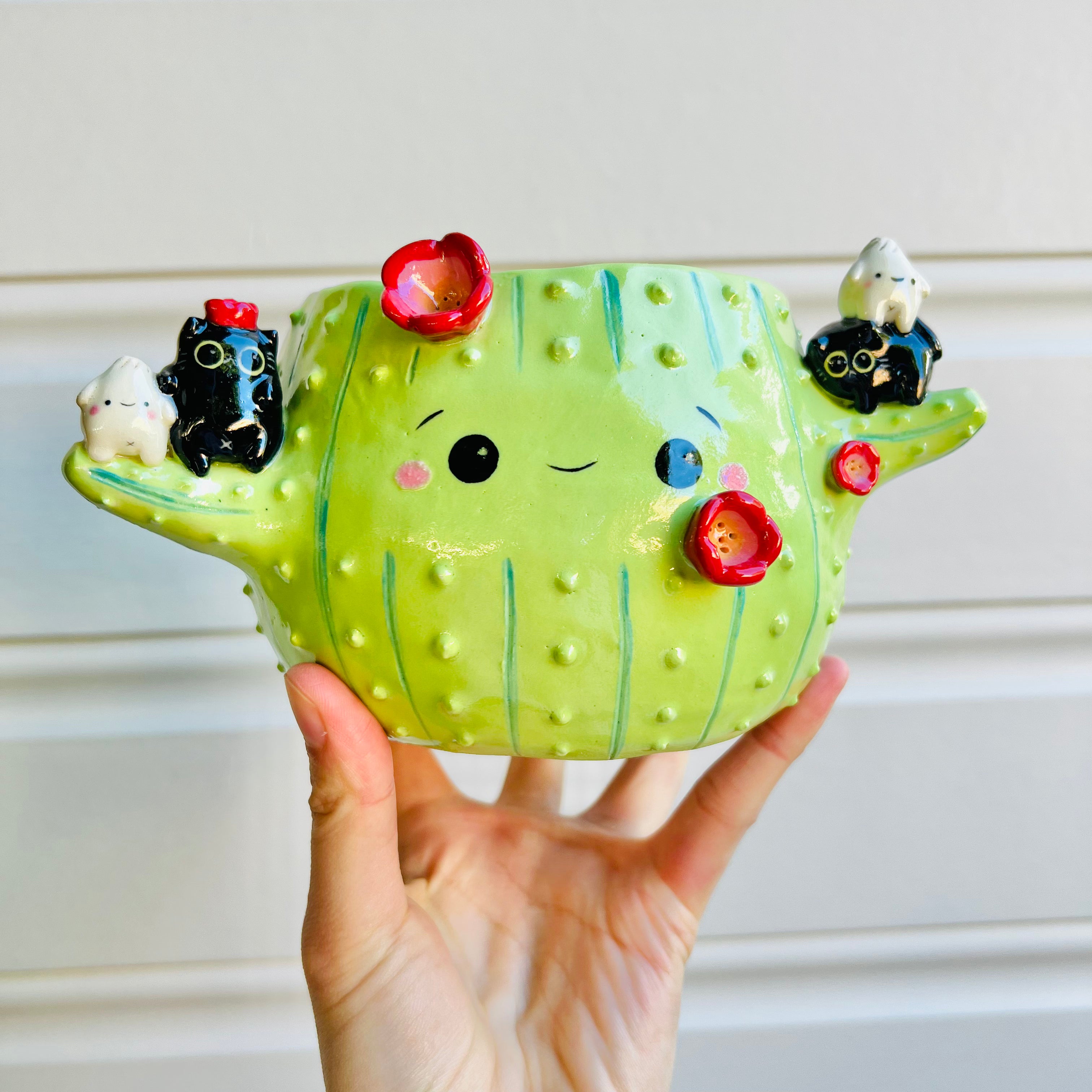 Flowery cactus pot with black cat and dumpling friends