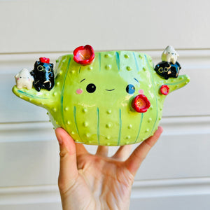 Flowery cactus pot with black cat and dumpling friends