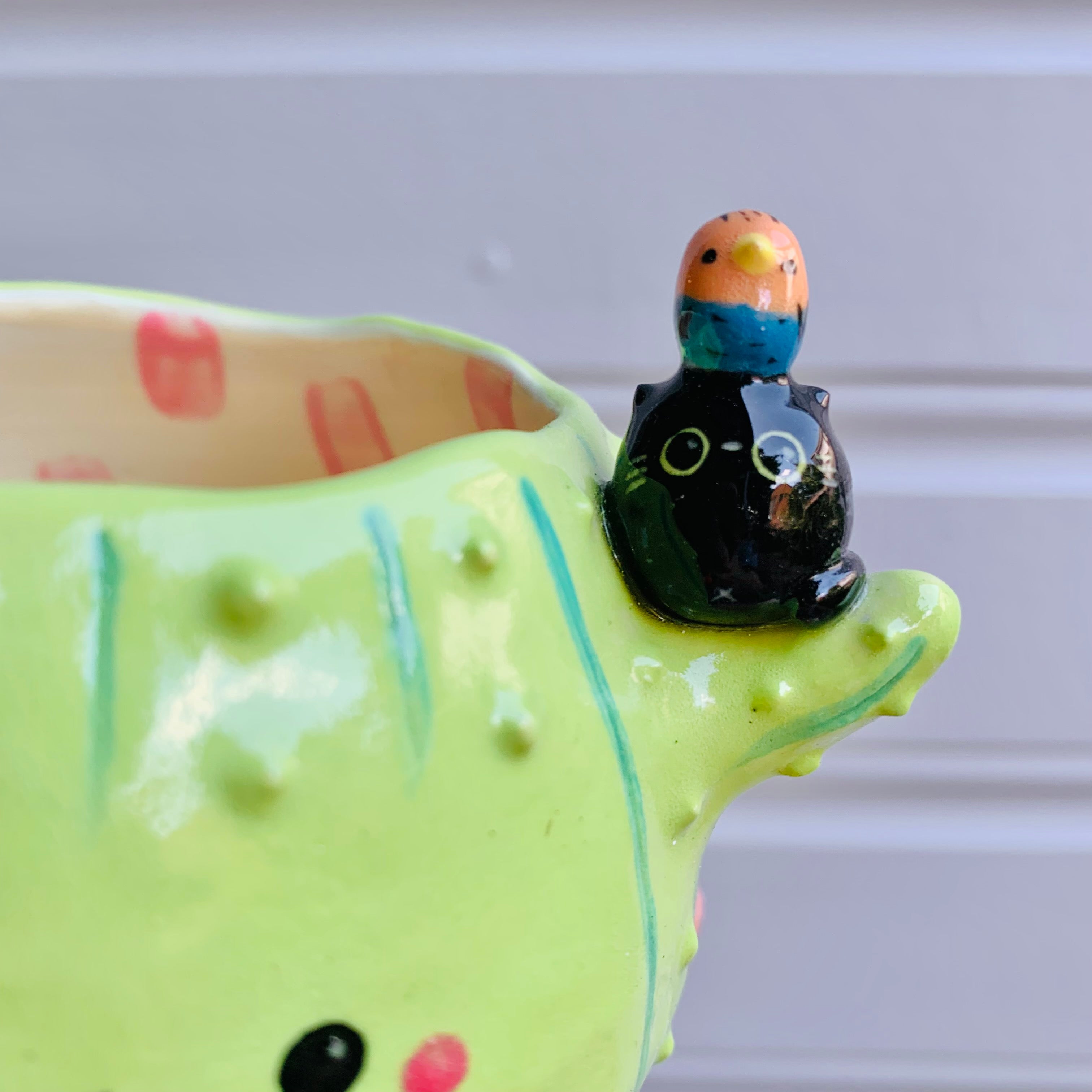 Flowery cactus pot with black cats and bird friends