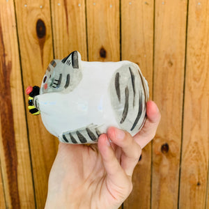 Stripey grey cat pot with bee friend