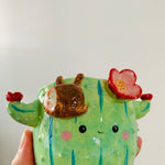 Flowery cactus pot with sloth friend