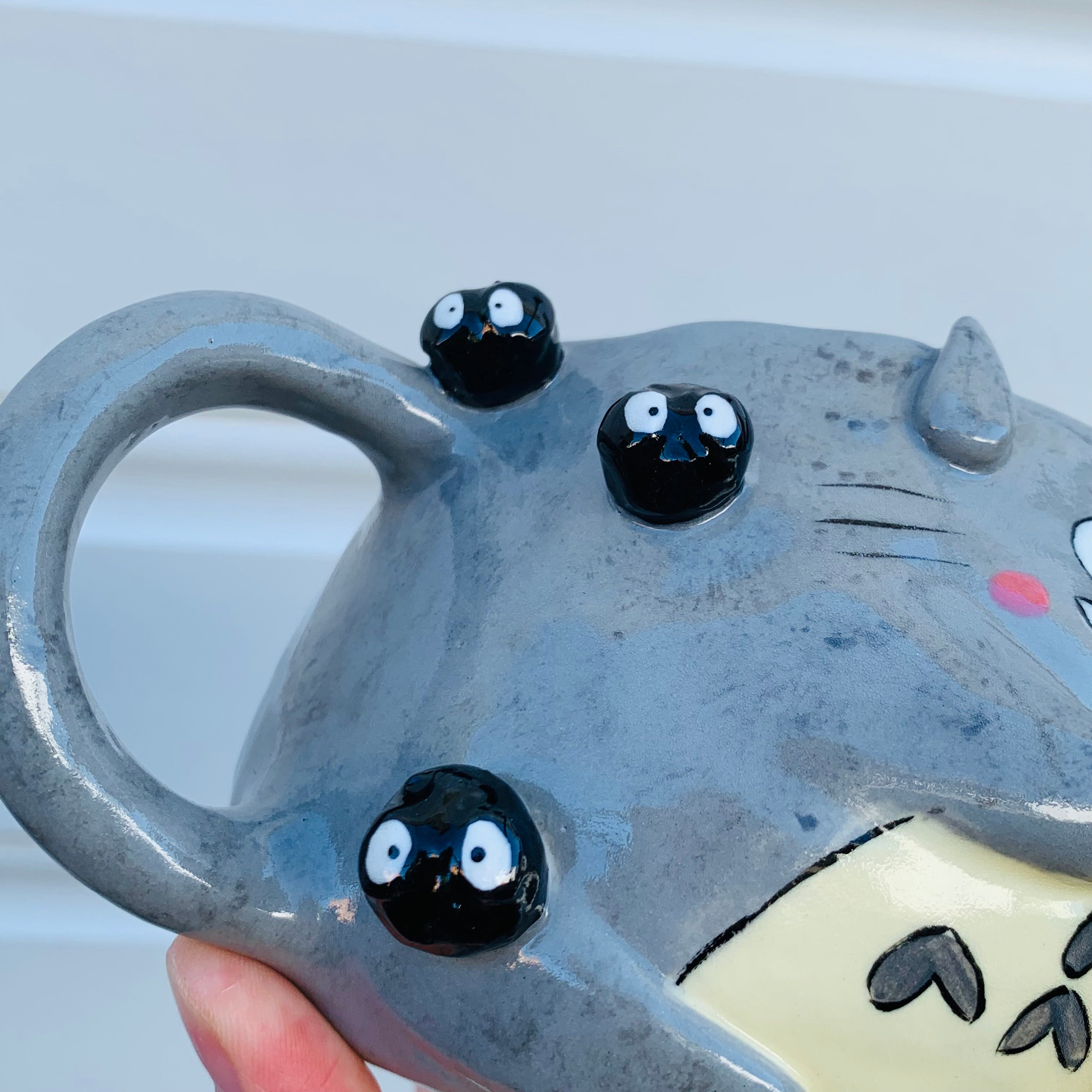 Smiling Totoro with bubble tea mug