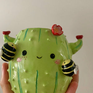 Flowery cactus pot with busy bee friends