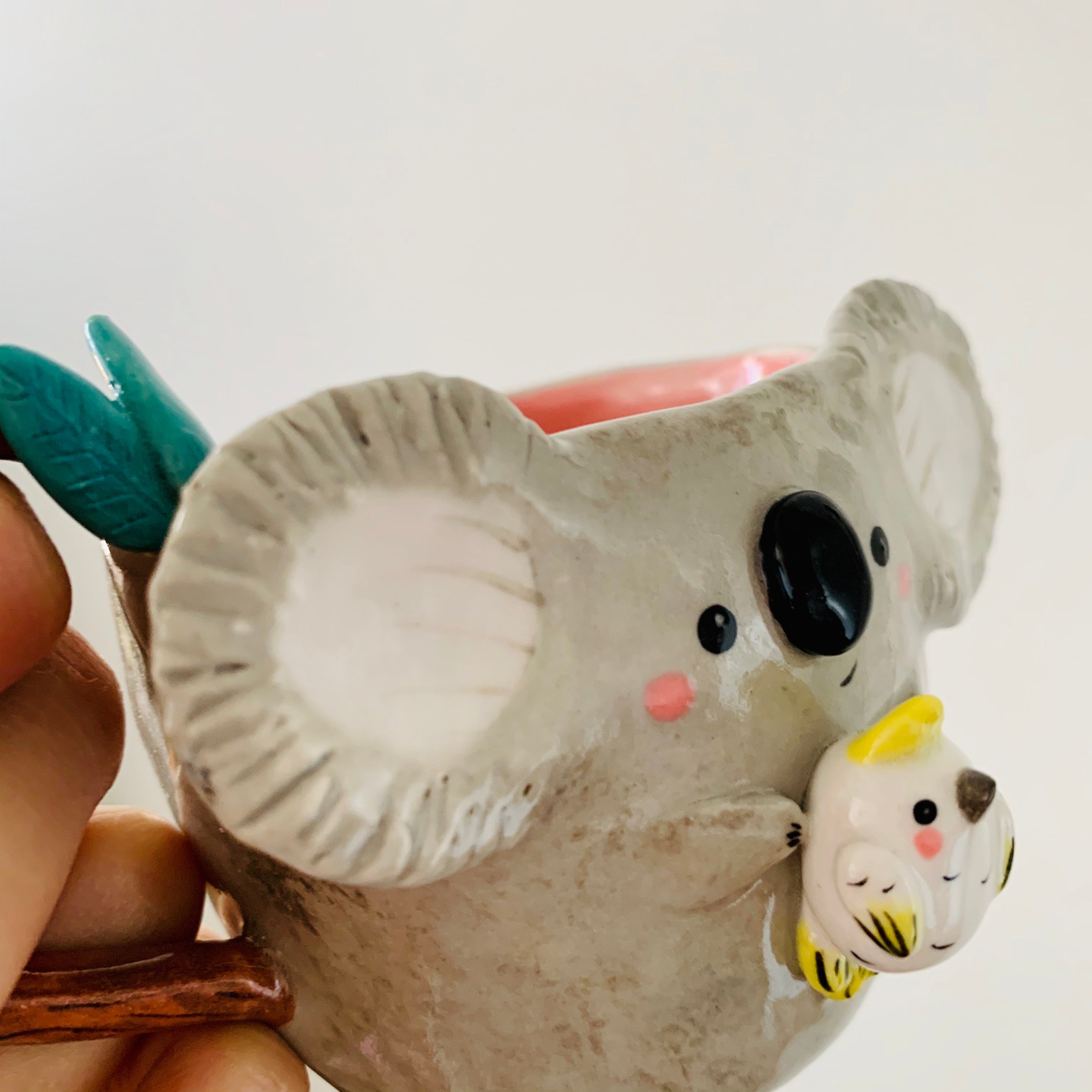 Koala with cockatoo friend mug