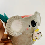 Koala with cockatoo friend mug
